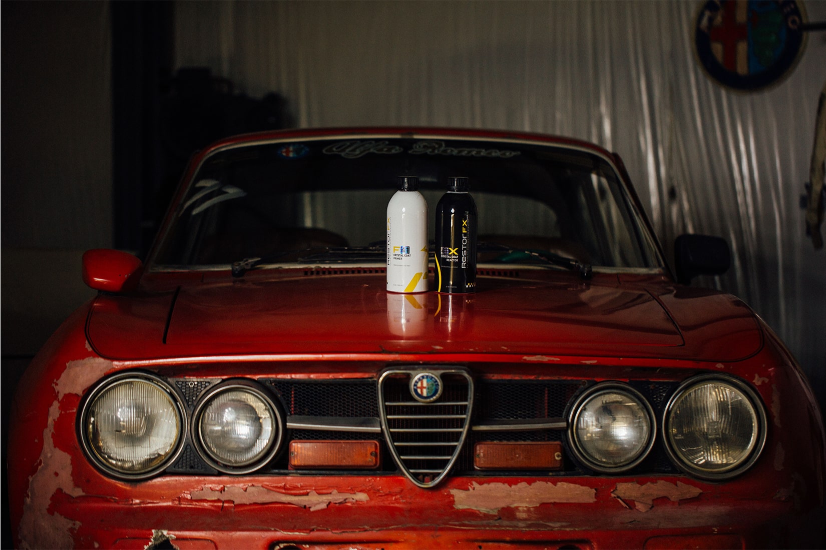 RestorFX Technician working expertly on a sleek yellow sports car with an overall blurred effect